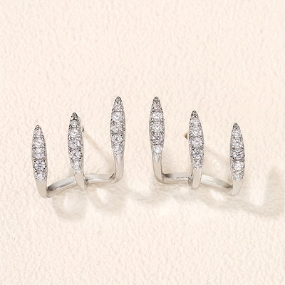 Elegantne naušnice sa tri kandže ukrašene draguljima