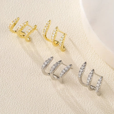 Elegantne naušnice sa tri kandže ukrašene draguljima